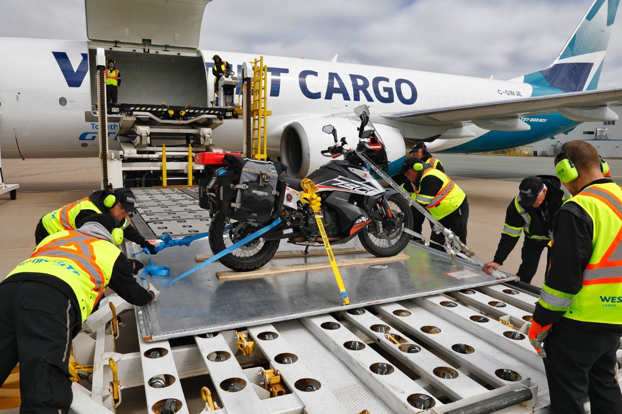 Bike being loaded on plane Bike being loaded on plane